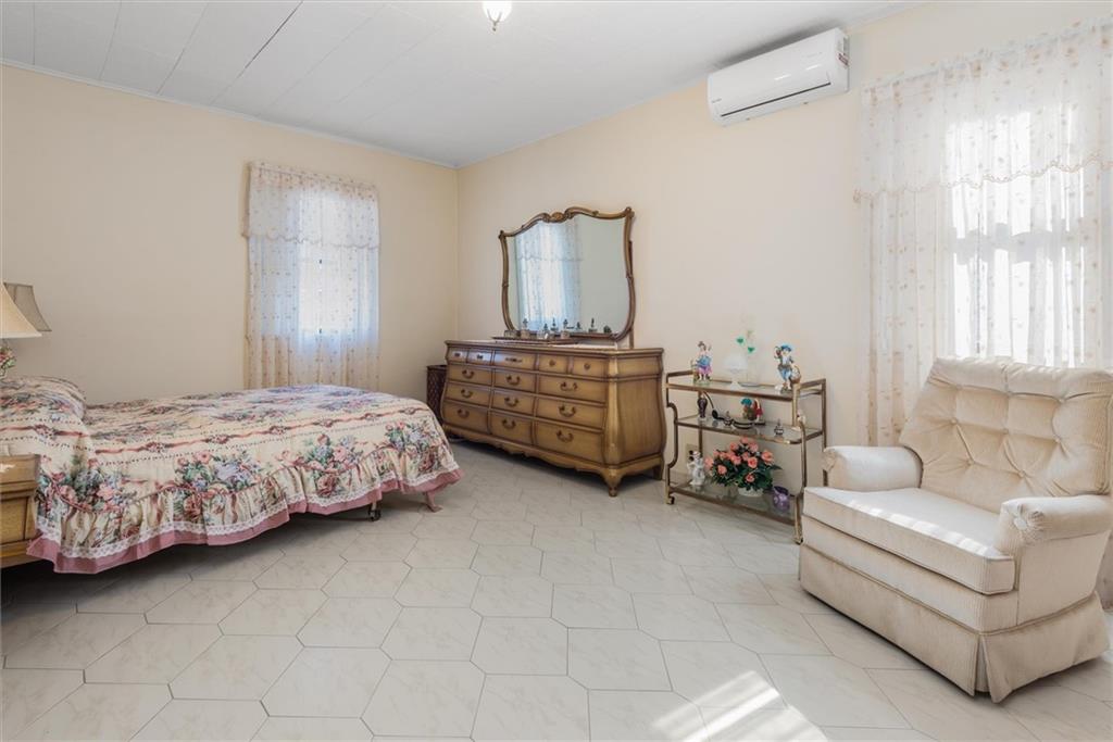 159 Hastings Street Brooklyn, NY 11235 - Photo 12 of 32 a bedroom with a bed and a couch