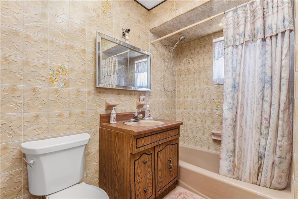 159 Hastings Street Brooklyn, NY 11235 - Photo 14 of 32 a bathroom with a sink a toilet and shower