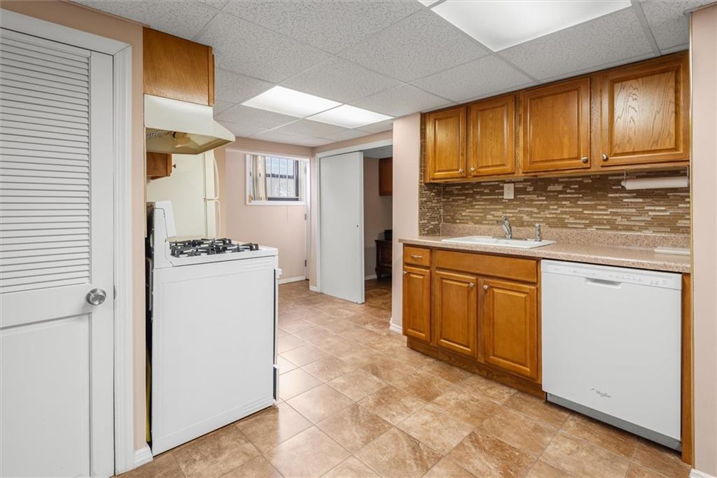 159 Hastings Street Brooklyn, NY 11235 - Photo 19 of 32 a kitchen with cabinets and appliances