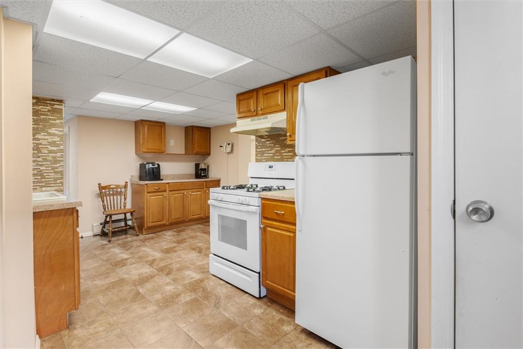 159 Hastings Street Brooklyn, NY 11235 - Photo 20 of 32 a kitchen with stainless steel appliances a refrigerator sink and cabinets