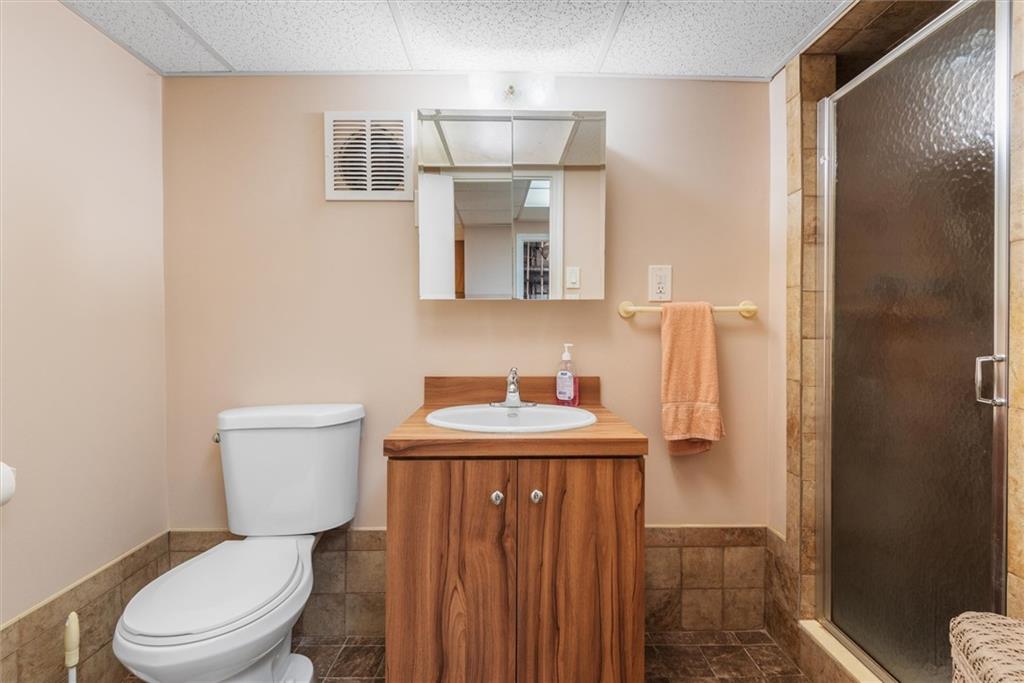 159 Hastings Street Brooklyn, NY 11235 - Photo 22 of 32 a bathroom with a toilet a sink and mirror