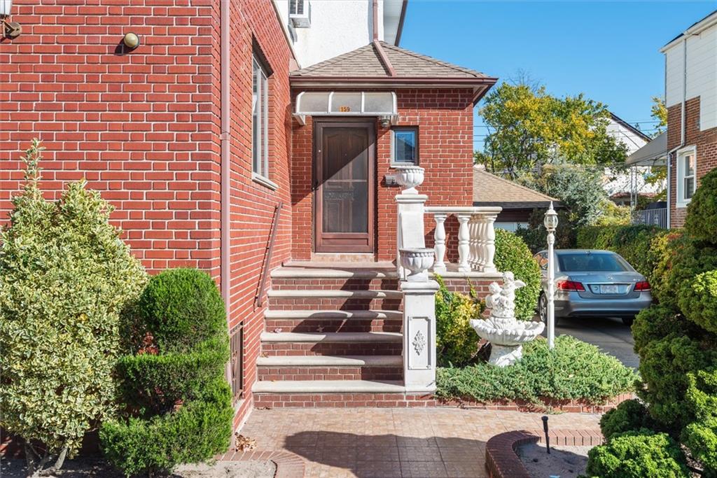 159 Hastings Street Brooklyn, NY 11235 - Photo 25 of 32 a front view of a house with a yard