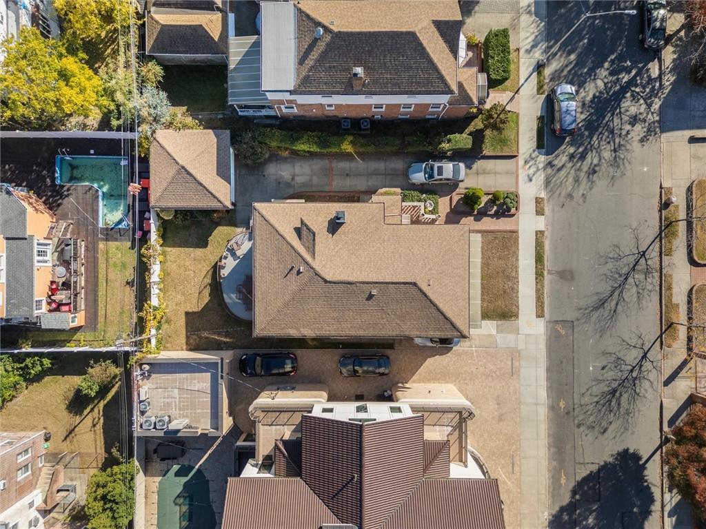 159 Hastings Street Brooklyn, NY 11235 - Photo 28 of 32 a aerial view of a house with swimming pool and sitting area