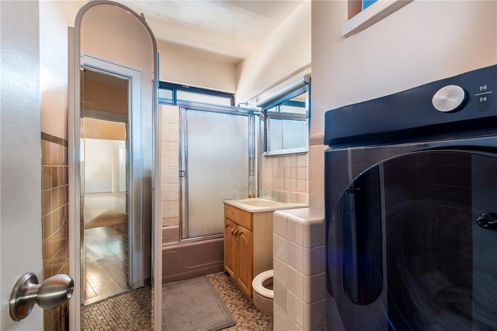 159 Hastings Street Brooklyn, NY 11235 - Photo 32 of 32 a kitchen with a refrigerator and sink