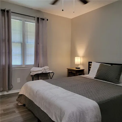 a bedroom with a bed and window