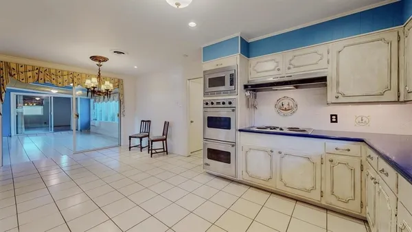 a kitchen with stainless steel appliances granite countertop a sink and cabinets