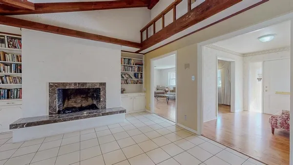 a view of an empty room and fire place