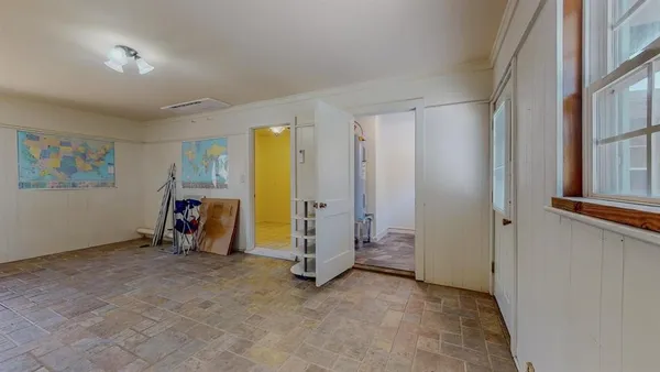 a view of room with workspace and windows