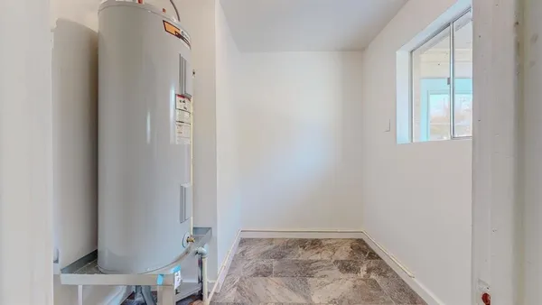 a view of an empty room with closet