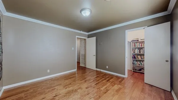 a room with furniture and wooden floor