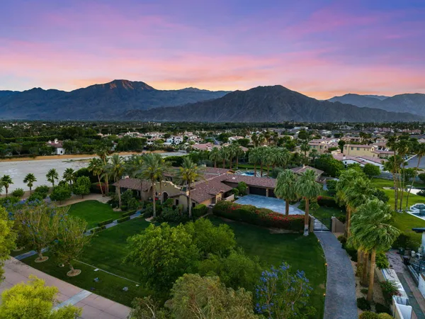 a kitchen with stainless steel appliances granite countertop a stove a sink and cabinets