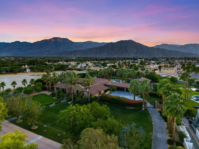 a kitchen with stainless steel appliances granite countertop a stove a sink and cabinets