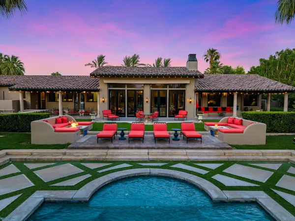 a living room with fireplace furniture and a flat screen tv
