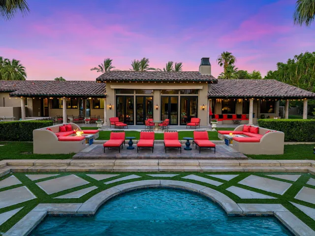 a living room with fireplace furniture and a flat screen tv