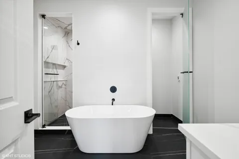 a white bath tub sitting in a bathroom