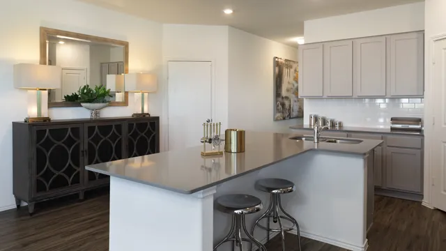 a kitchen with a sink cabinets and window