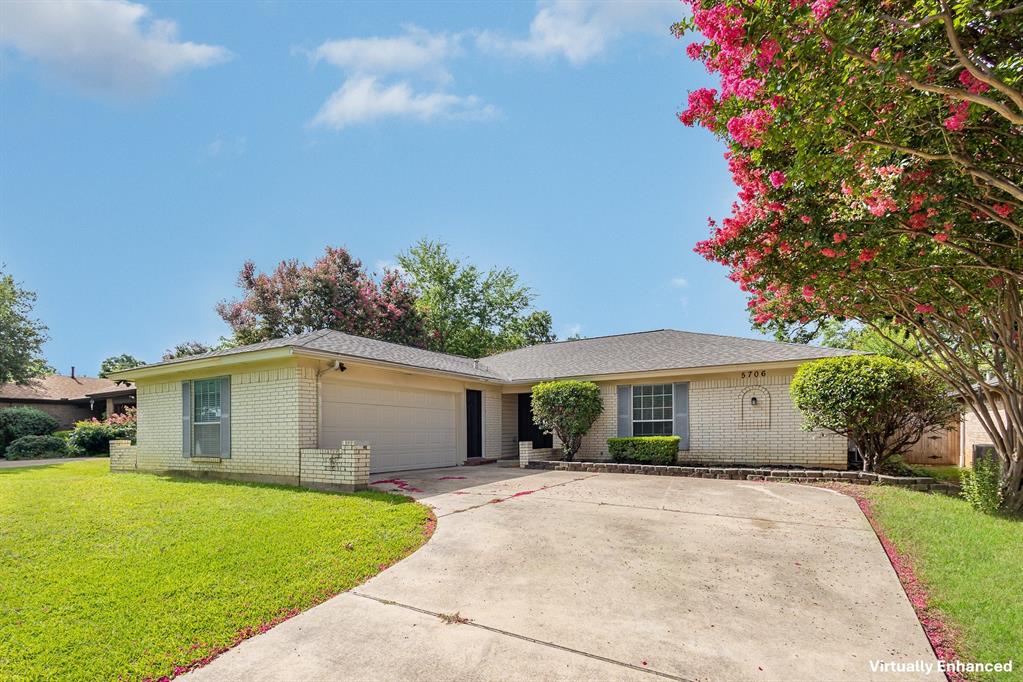 5706 Ridge Drive Arlington, TX 76016 - Photo 1 of 1 a front view of a house with a garden