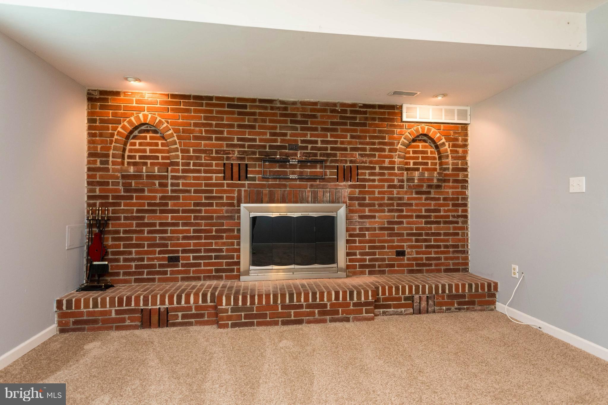 703 Londontown Road Edgewater, MD 21037 - Photo 8 of 28 Living Room / Beautiful Brick Wall with Fireplace