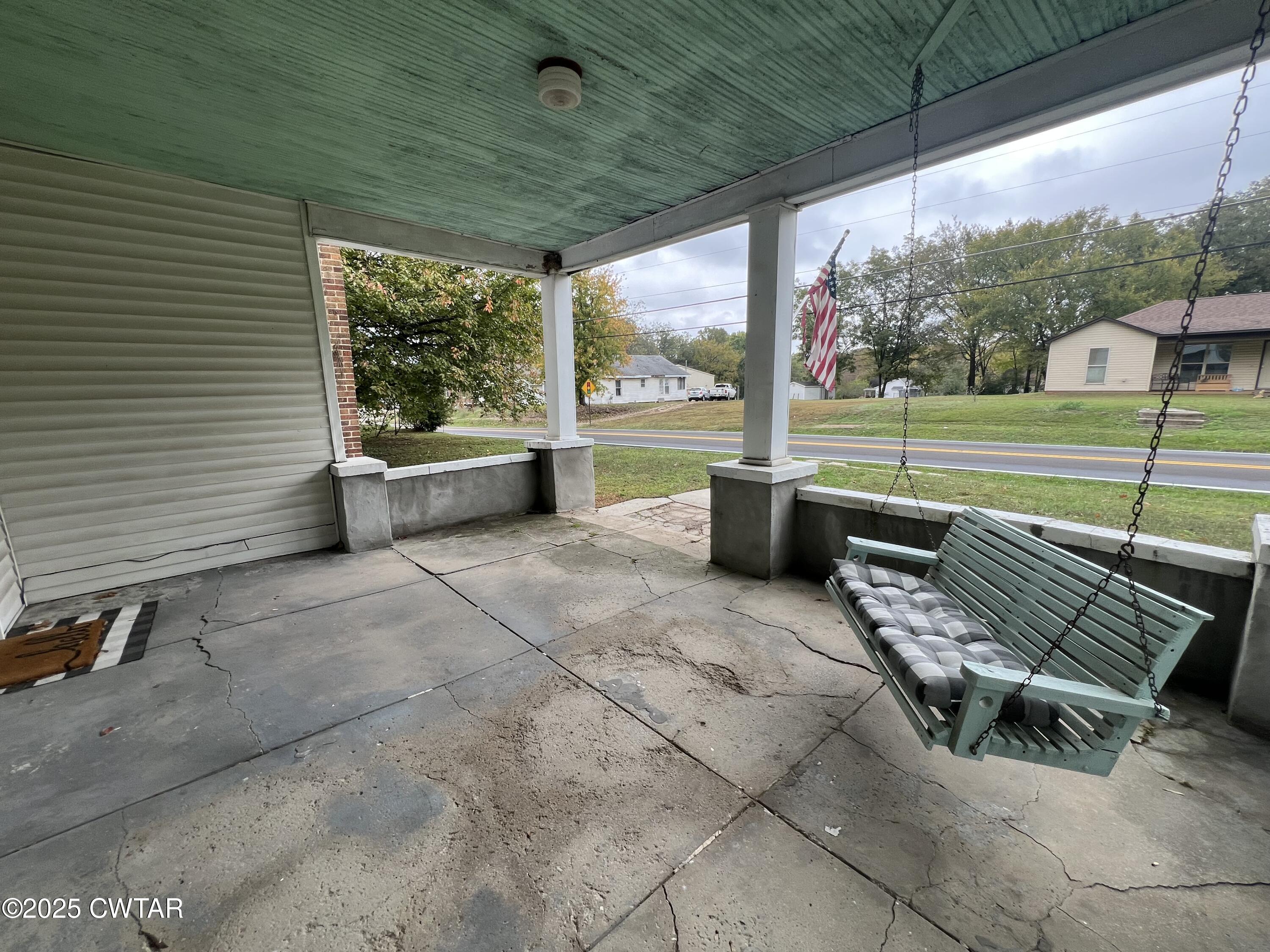 117 South Main Street Gibson, TN 38343 - Photo 15 of 40 a swimming pool with outdoor seating