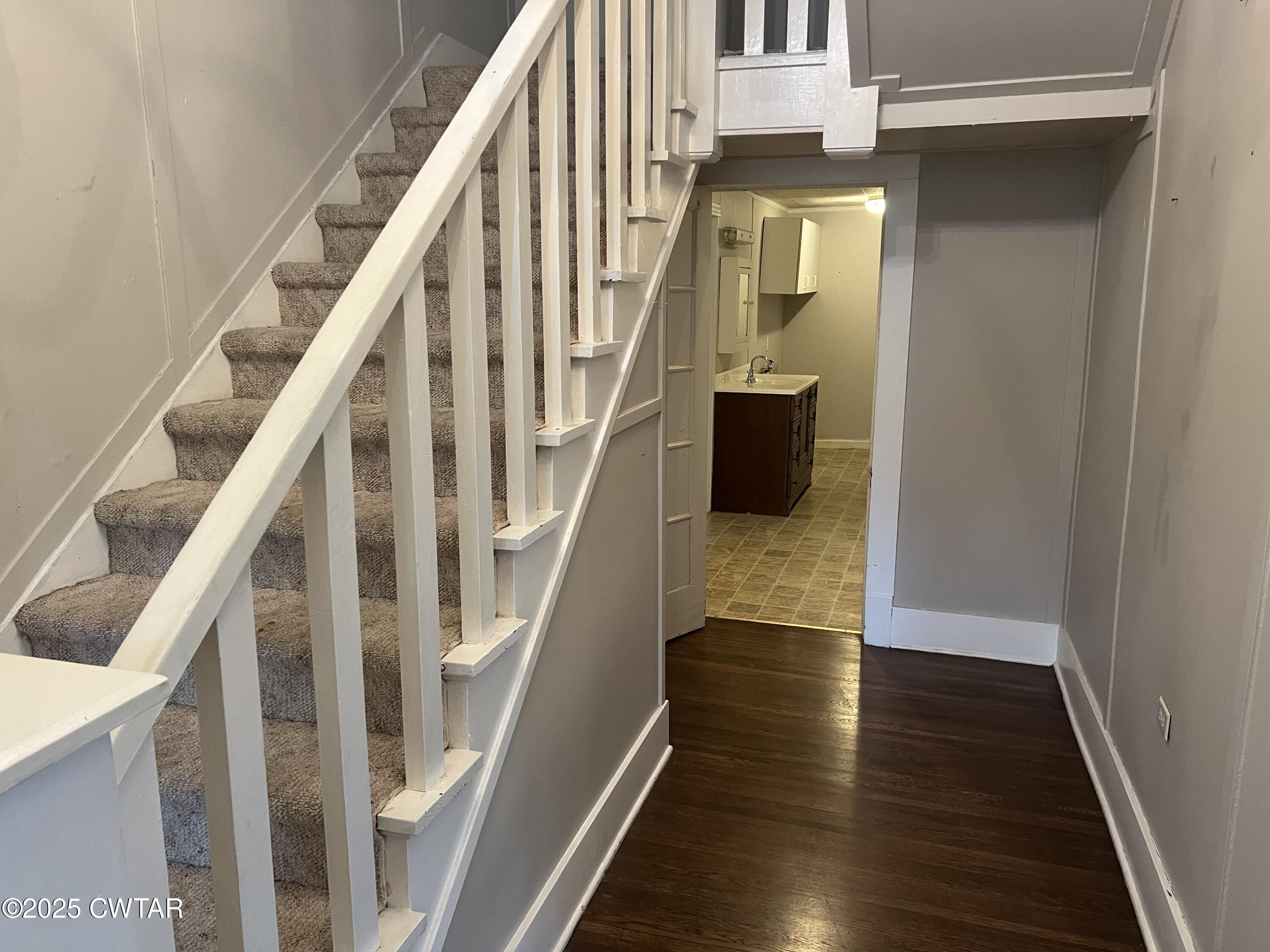 117 South Main Street Gibson, TN 38343 - Photo 22 of 40 a view of an entryway with wooden floor and stair