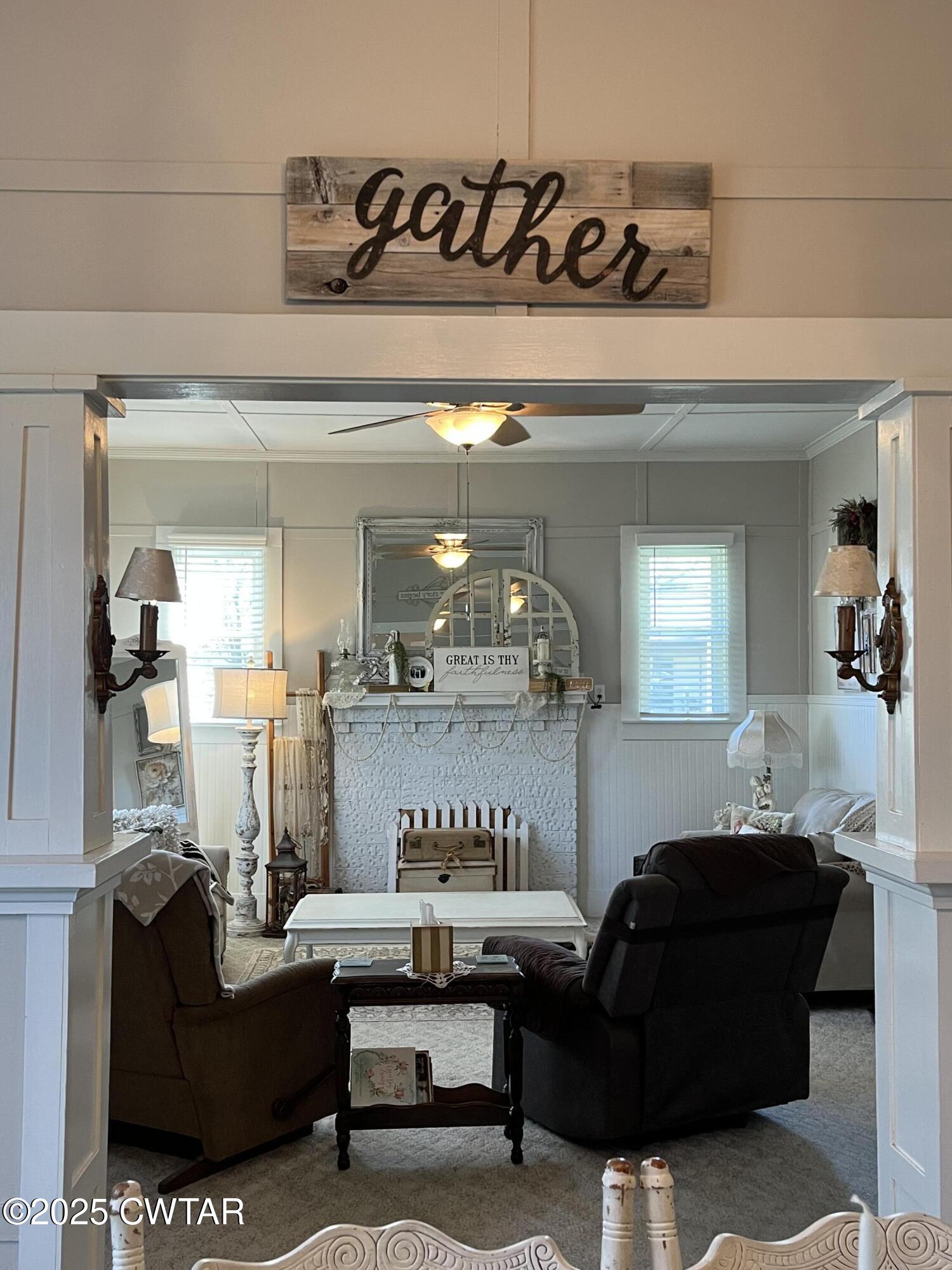 117 South Main Street Gibson, TN 38343 - Photo 23 of 40 a living room with furniture and a fireplace