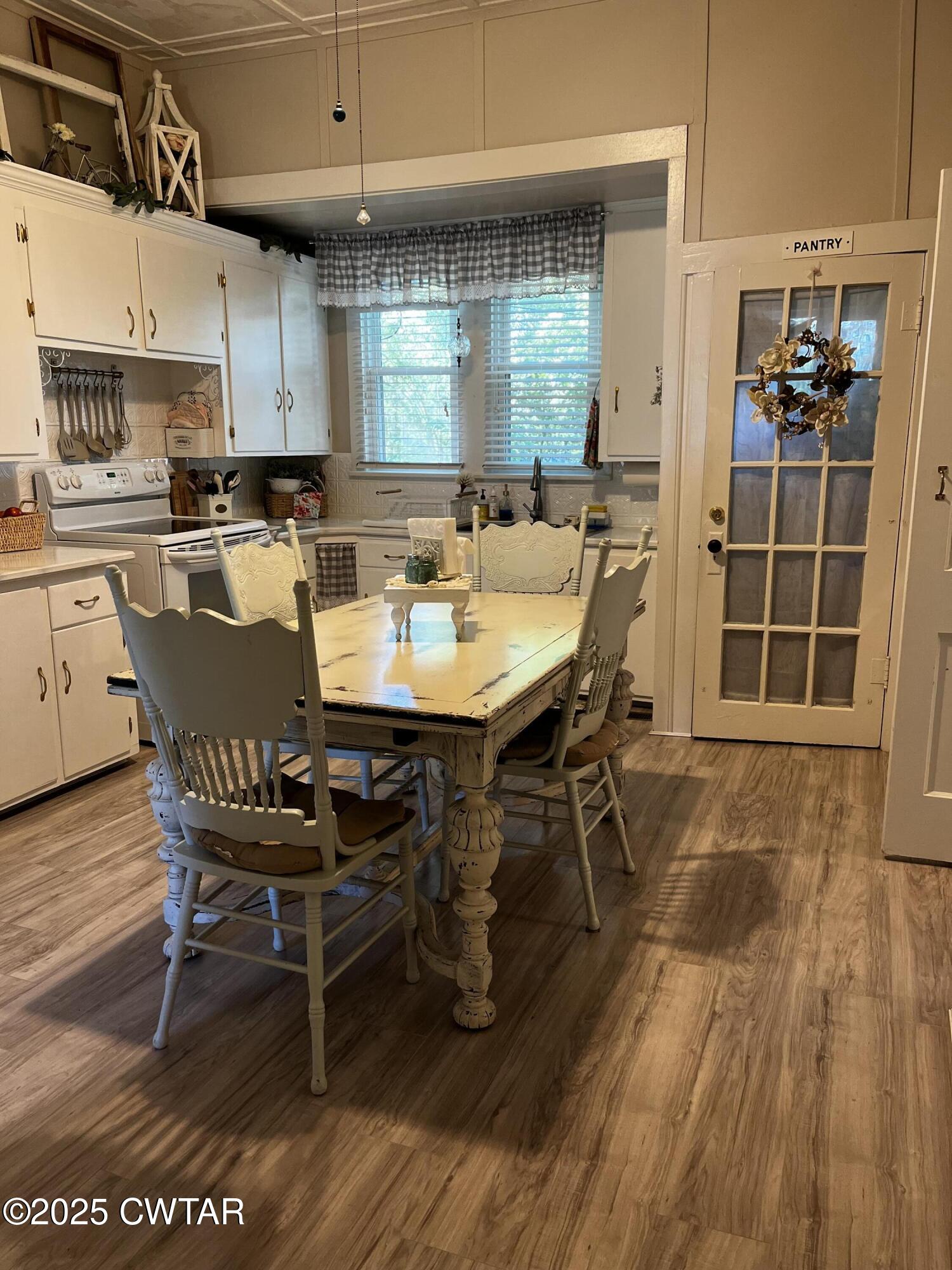 117 South Main Street Gibson, TN 38343 - Photo 27 of 40 a view of a dining room with furniture window and wooden floor