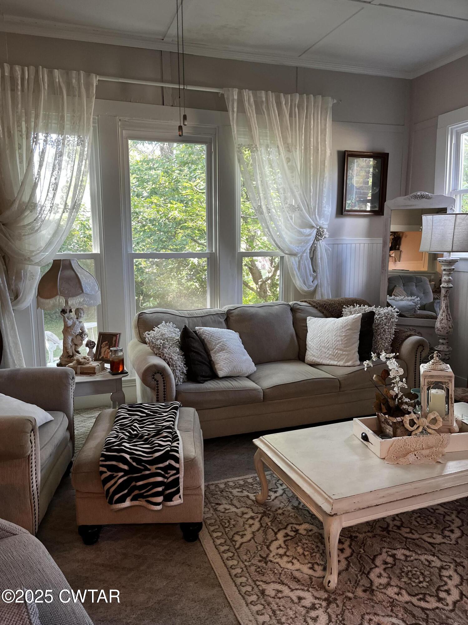117 South Main Street Gibson, TN 38343 - Photo 29 of 40 a living room with furniture and a large window