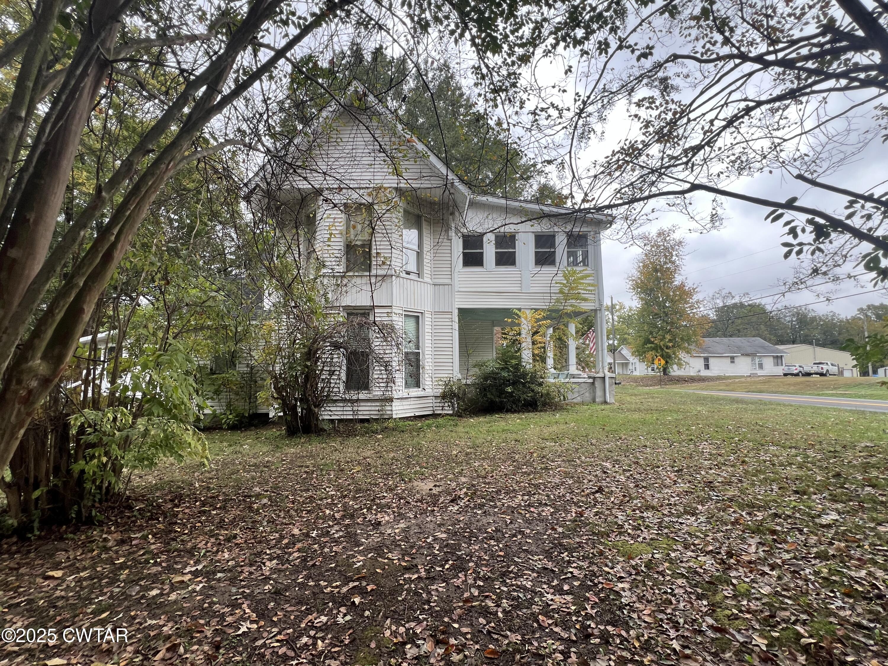 117 South Main Street Gibson, TN 38343 - Photo 3 of 40 a view of a house with a yard