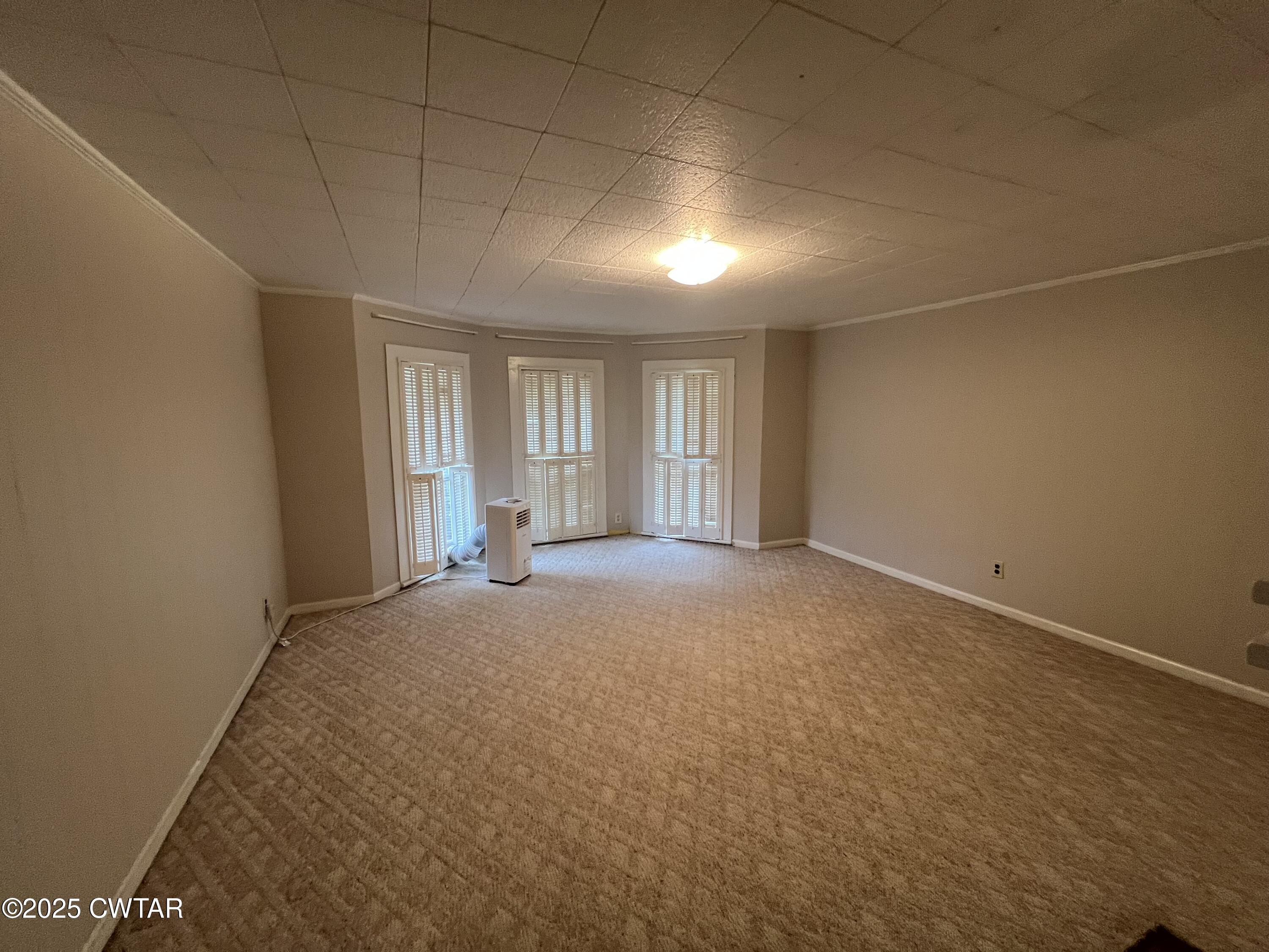 117 South Main Street Gibson, TN 38343 - Photo 32 of 40 an empty room with windows