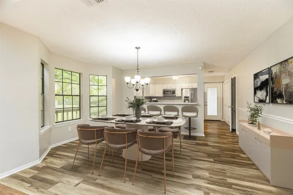 a kitchen with stainless steel appliances kitchen island granite countertop a sink and cabinets