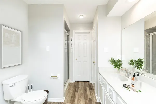 a bathroom with a sink a toilet and tub