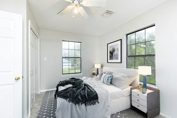 a bedroom with bed and a window