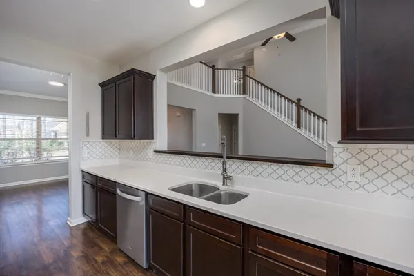 a kitchen with stainless steel appliances granite countertop a stove and a sink