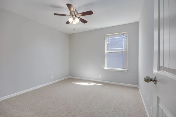 wooden floor in an empty room and a window