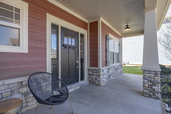 a view of a porch with seating space