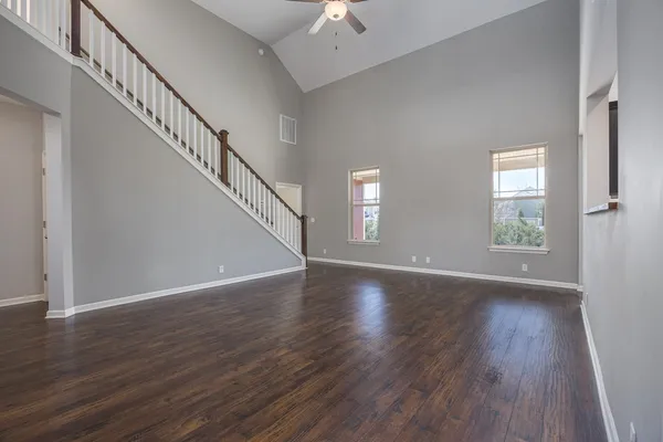 a view of an entryway with wooden floor and door