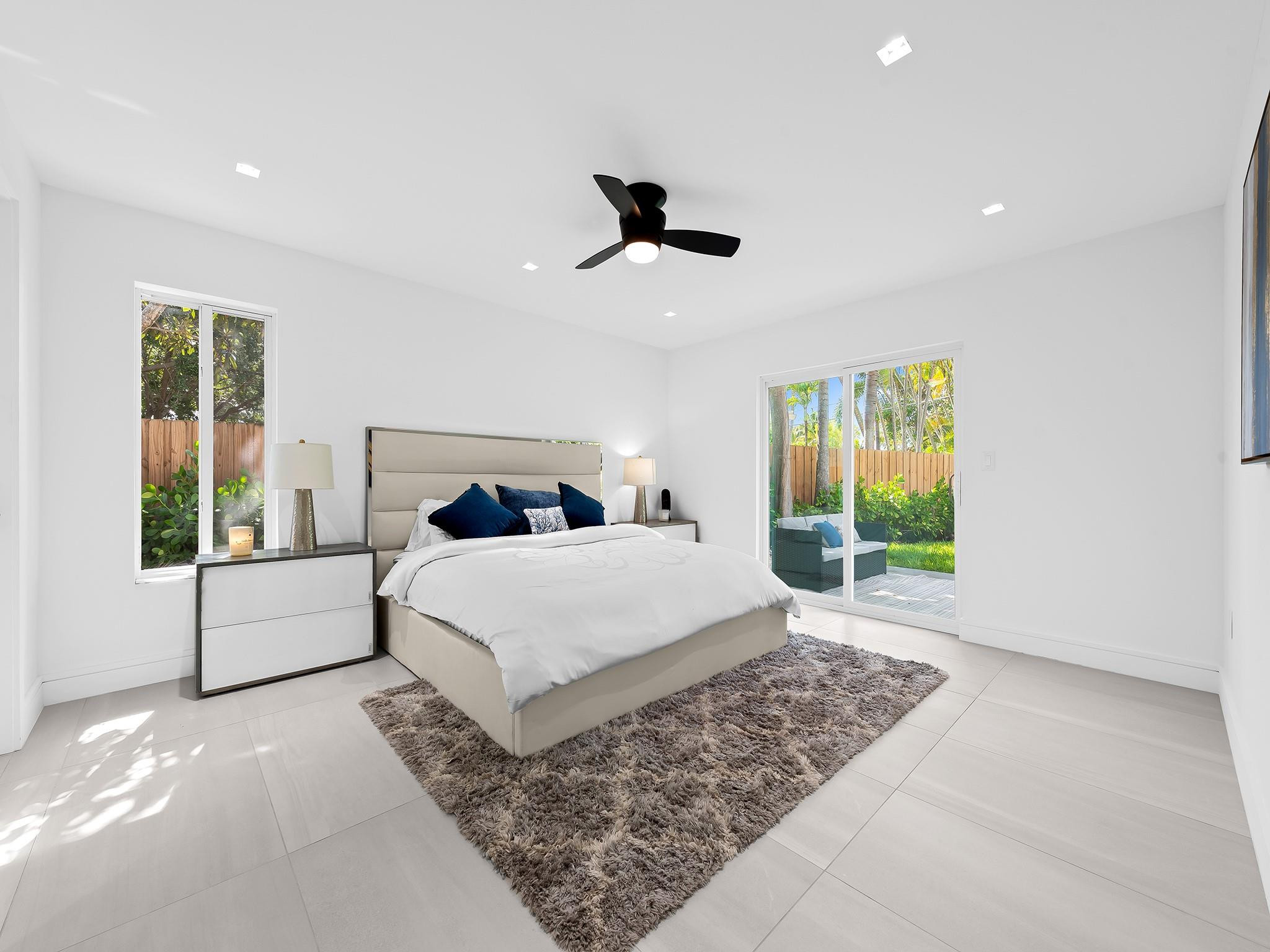 332 Northeast 29th Street Wilton Manors, FL 33334 - Photo 14 of 28 a bedroom with a large bed and a window