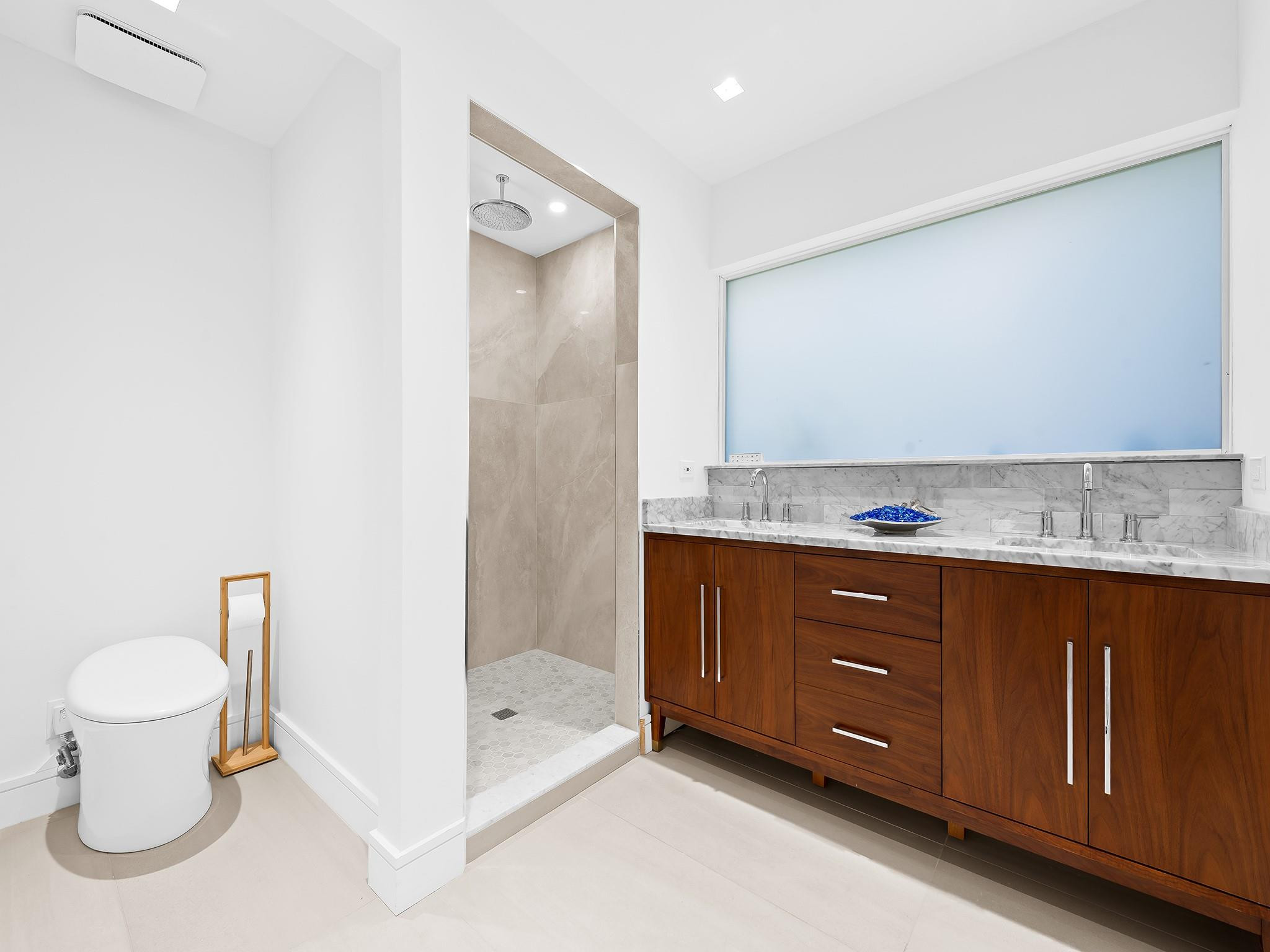 332 Northeast 29th Street Wilton Manors, FL 33334 - Photo 17 of 28 a bathroom with a granite countertop sink and a mirror