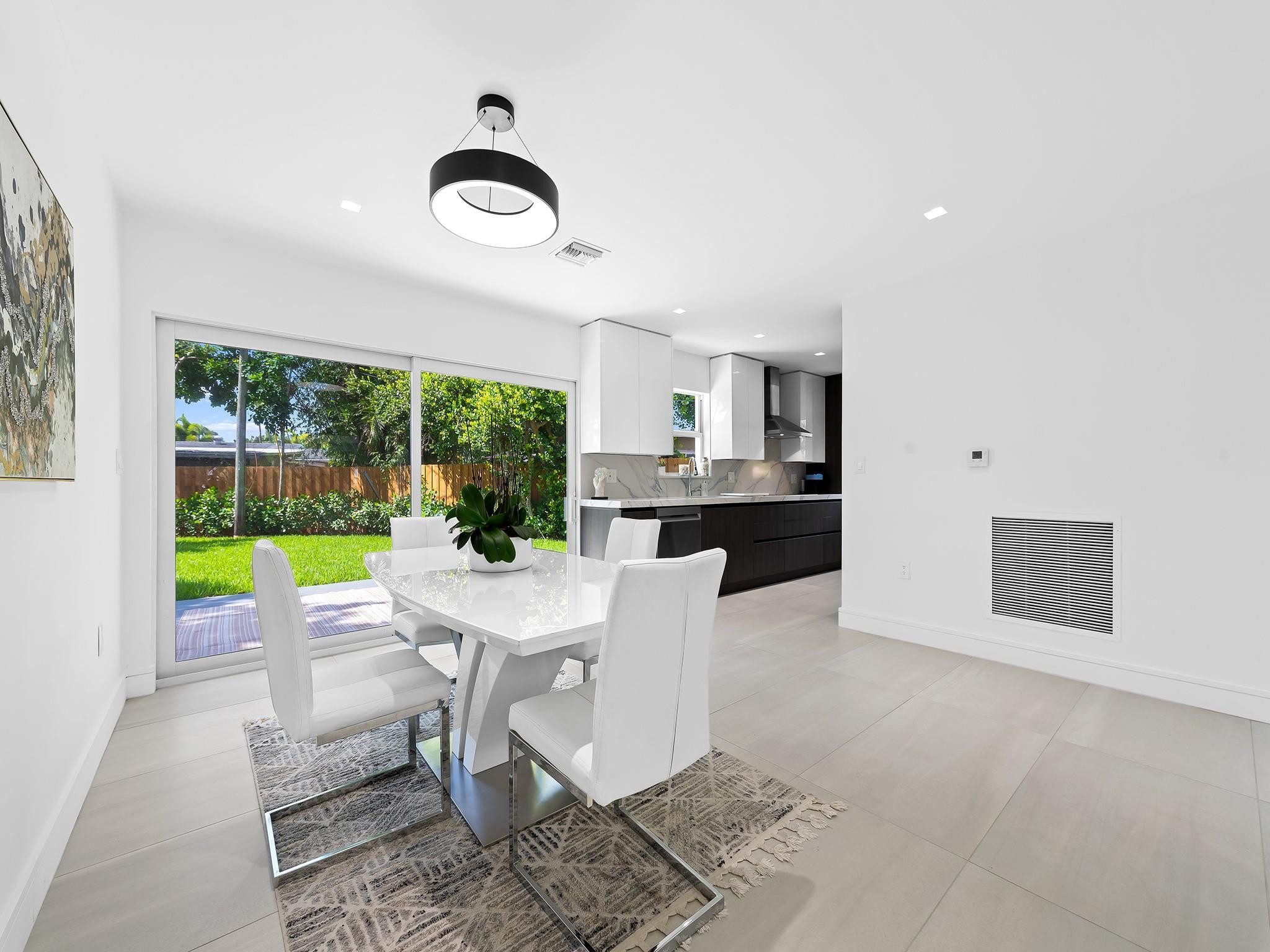332 Northeast 29th Street Wilton Manors, FL 33334 - Photo 8 of 28 a view of a dining room with furniture window and outside view