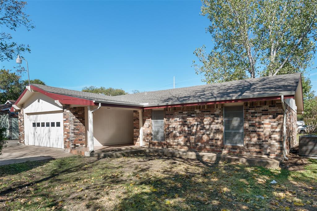 703 Rolling Ridge Lane Duncanville, TX 75116 - Photo 16 of 38 Single story home featuring an attached garage, brick siding, a shingled roof, and driveway
