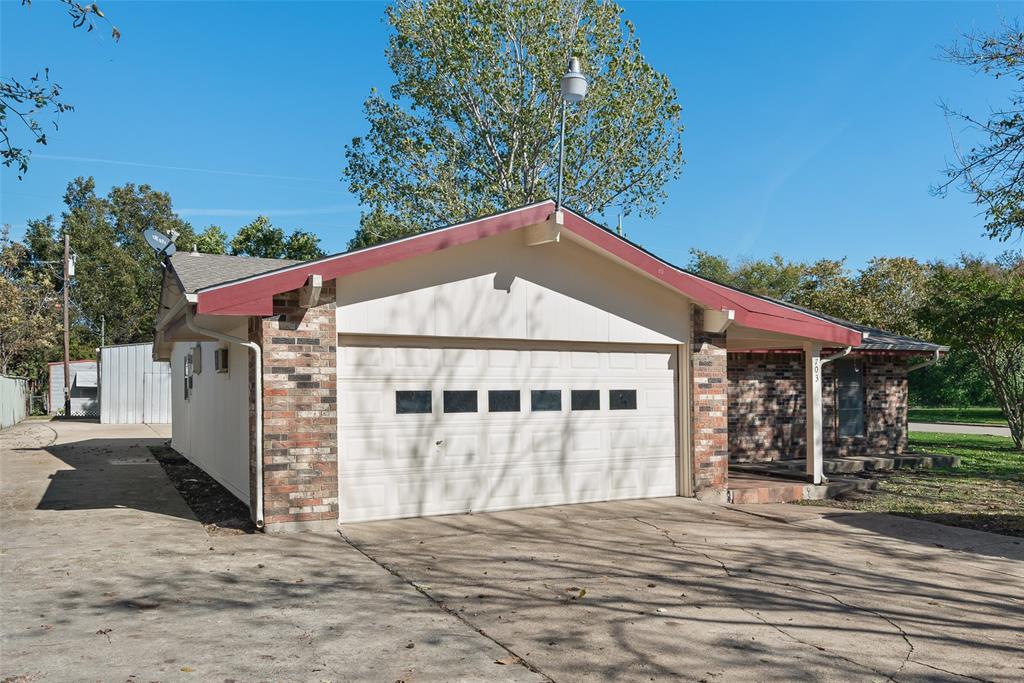 703 Rolling Ridge Lane Duncanville, TX 75116 - Photo 3 of 38 View of front of house with driveway, an attached garage, and brick siding