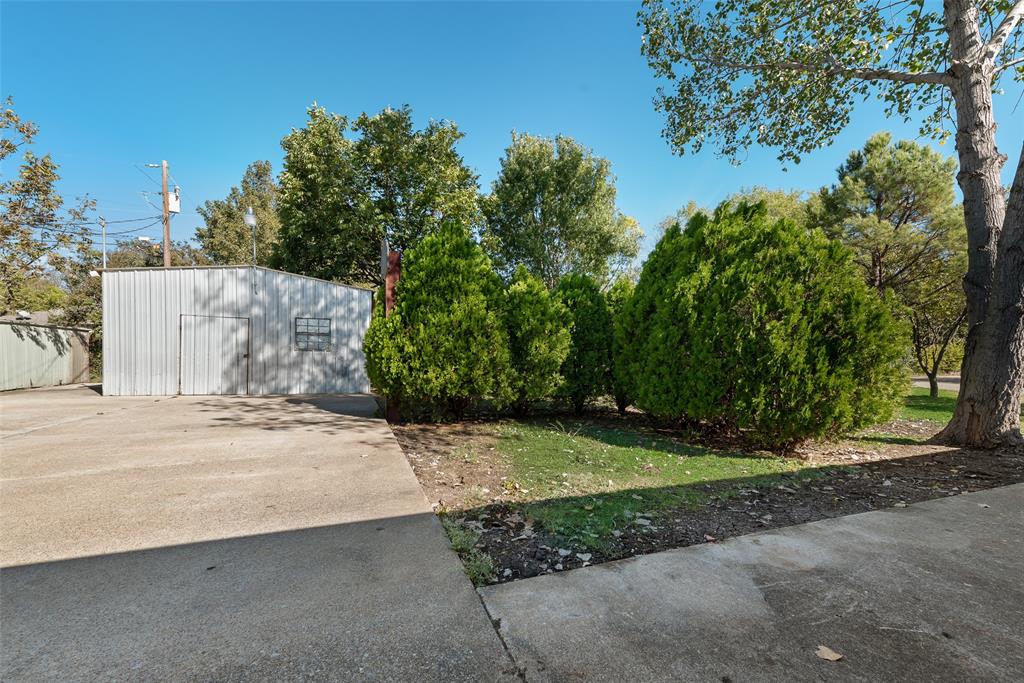 703 Rolling Ridge Lane Duncanville, TX 75116 - Photo 31 of 38 View of yard featuring an outdoor structure