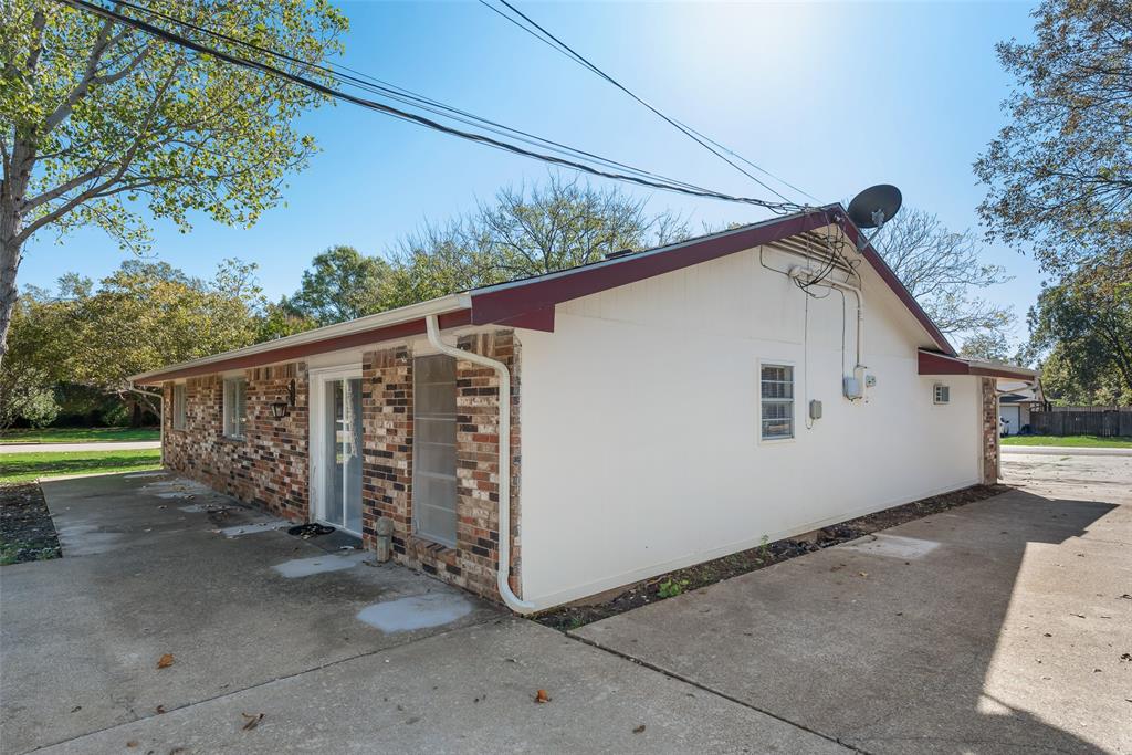 703 Rolling Ridge Lane Duncanville, TX 75116 - Photo 35 of 38 View of home's exterior with stone siding