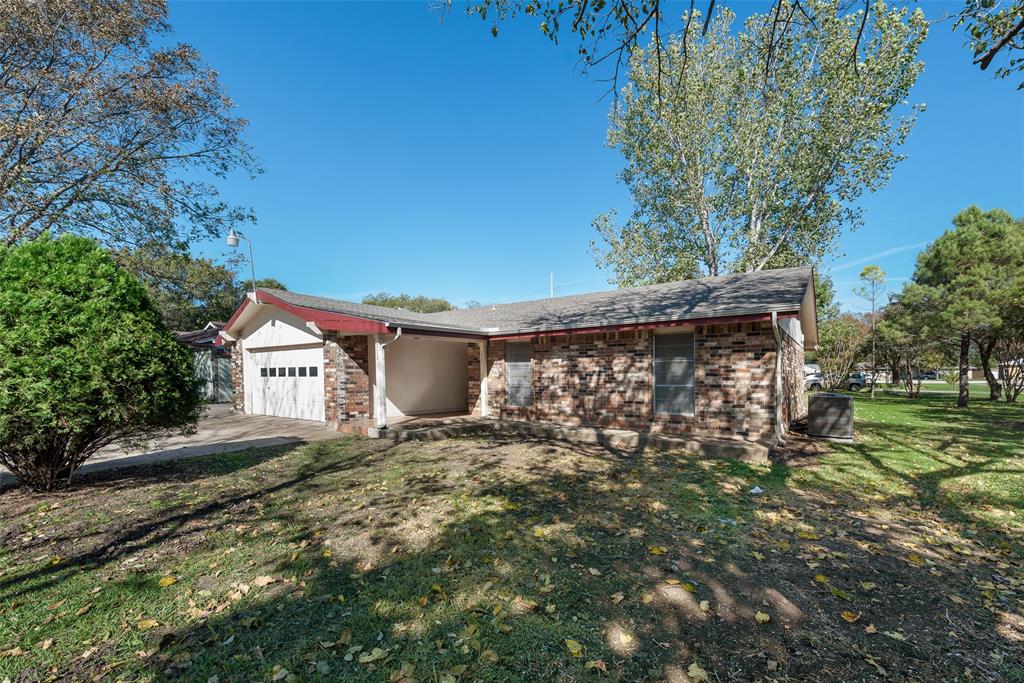 703 Rolling Ridge Lane Duncanville, TX 75116 - Photo 38 of 38 Single story home with brick siding, an attached garage, and a front yard