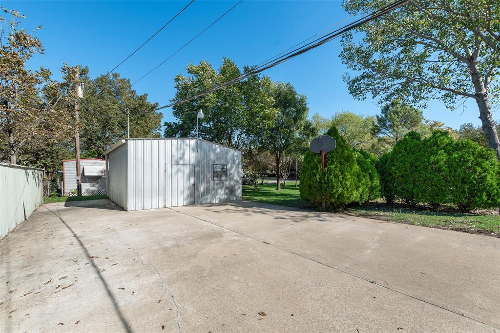 703 Rolling Ridge Lane Duncanville, TX 75116 - Photo 5 of 38 View of patio / terrace with an outdoor structure