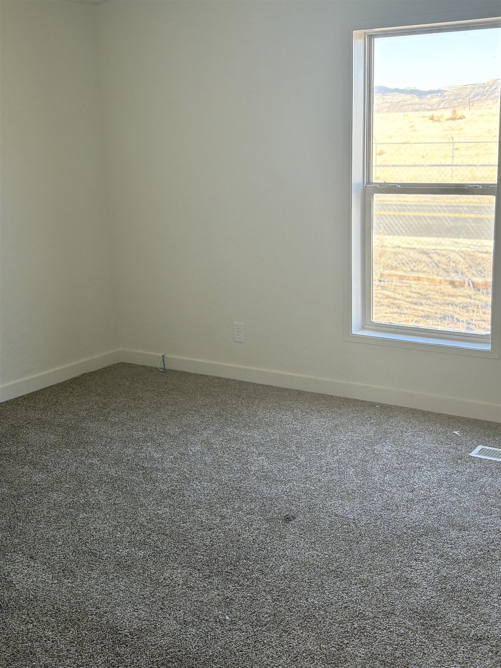 424 32 Road, Unit 374 Clifton, CO 81520 - Photo 4 of 11 an empty room with a window