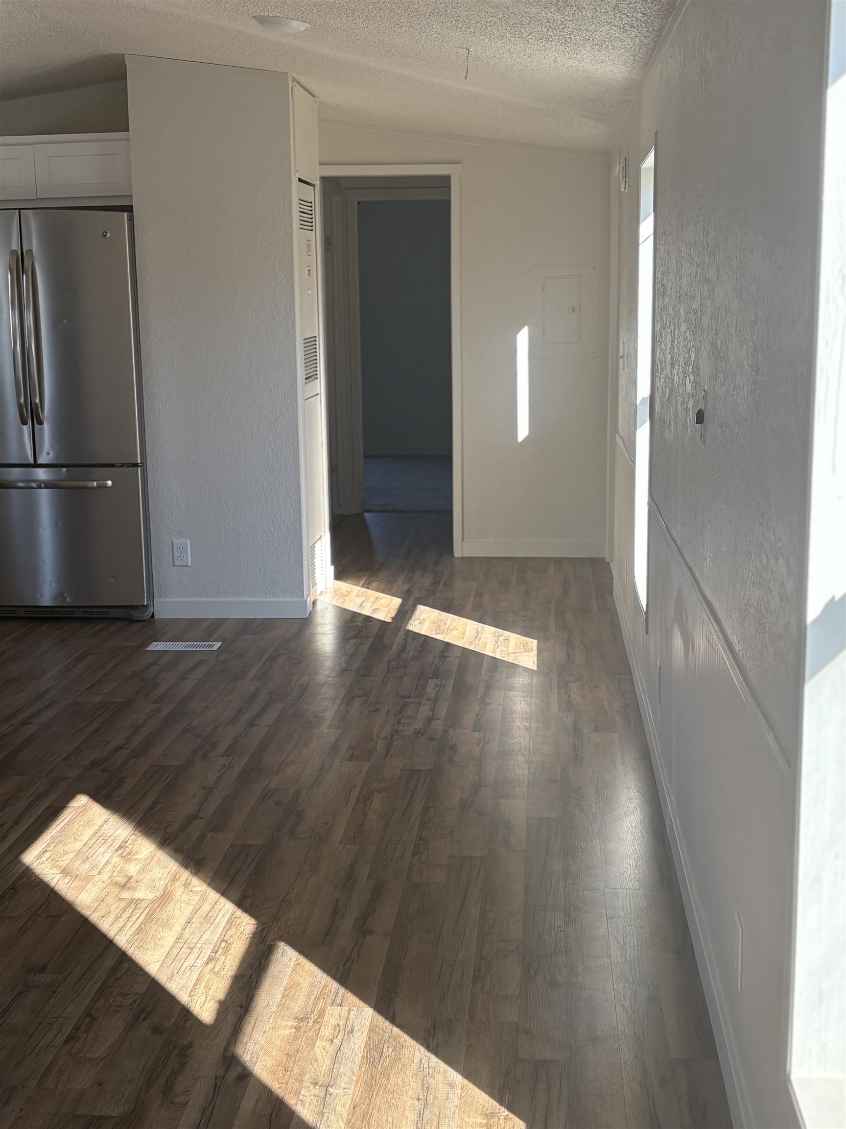 424 32 Road, Unit 374 Clifton, CO 81520 - Photo 8 of 11 a view of an empty room and wooden floor
