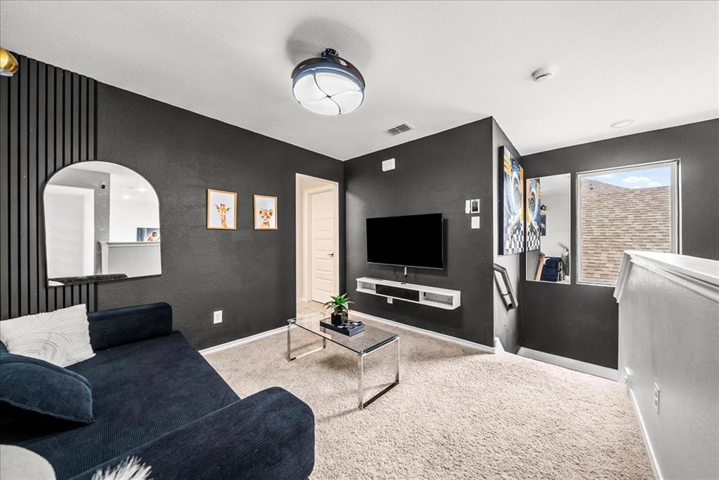 1908 Twisted Tree Lane Mesquite, TX 75149 - Photo 11 of 22 Carpeted living room featuring baseboards