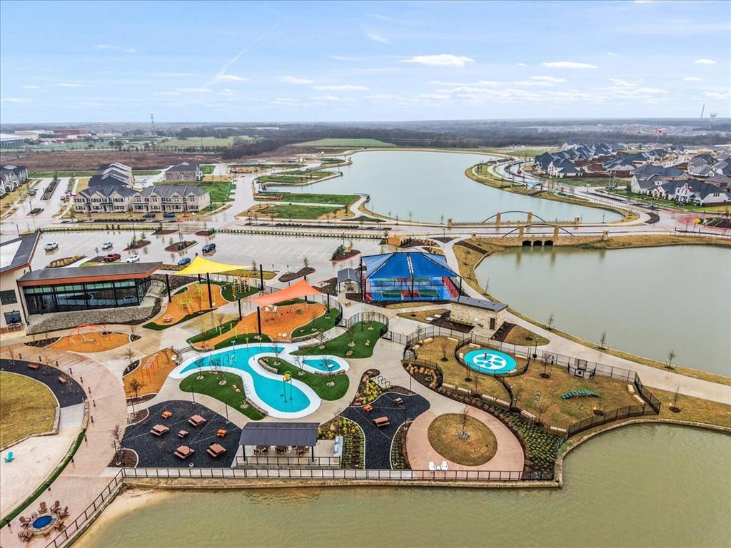 1908 Twisted Tree Lane Mesquite, TX 75149 - Photo 18 of 22 Drone / aerial view of a nearby body of water and a pool