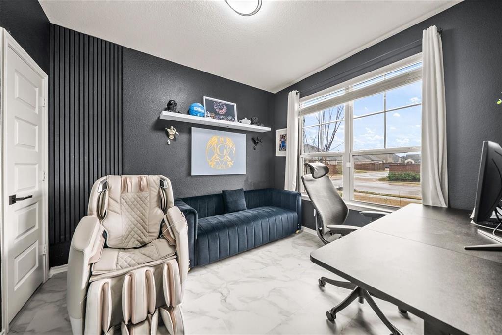 1908 Twisted Tree Lane Mesquite, TX 75149 - Photo 4 of 22 Home office with light marble finish flooring and a textured wall